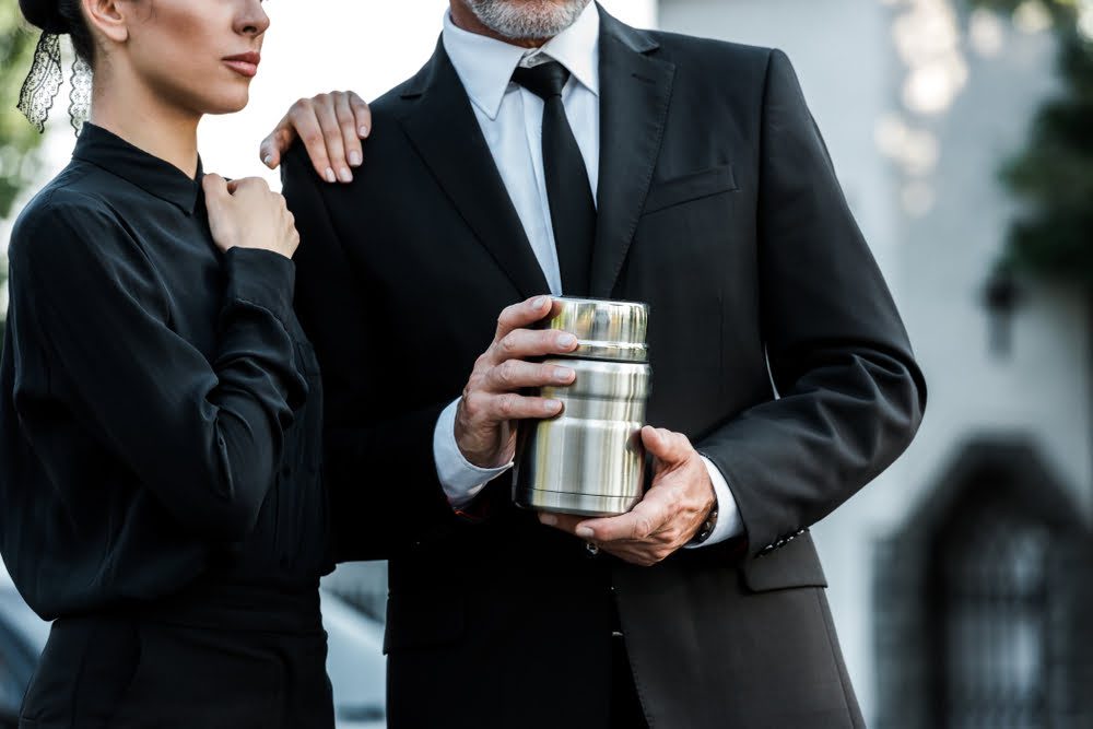 At a funeral, who carries the urn in UK? Who is authorized to do this?